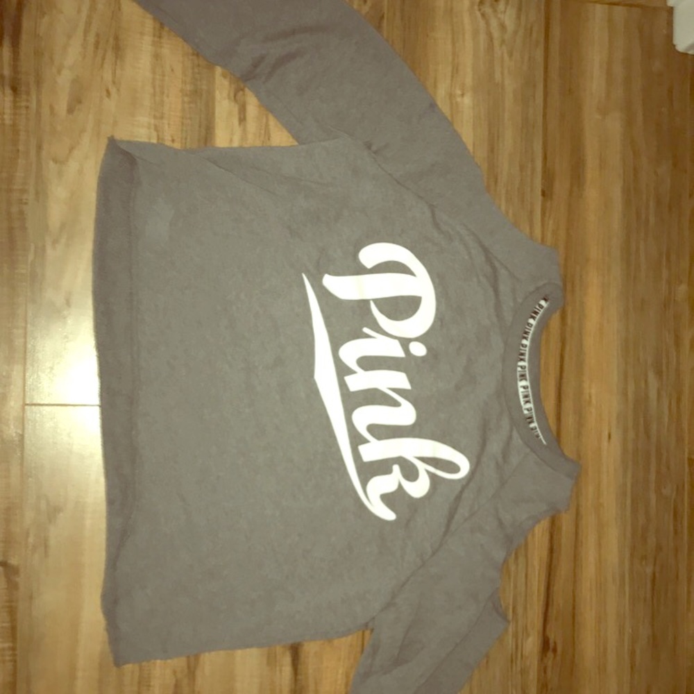 Pink brand grey shoulder-less long sleeve shirt.